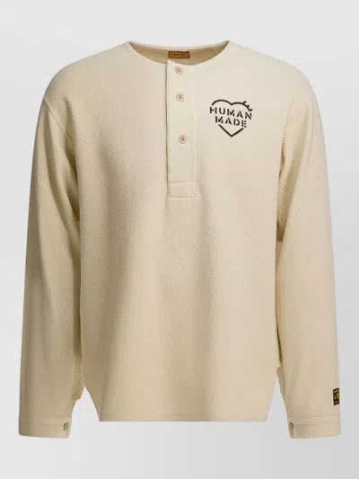 HUMAN MADE LONG SLEEVE HENLEY T-SHIRT TEXT PRINT