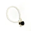 I'mmany London Women's Very Berry Pearl Bracelet With Lampwork Glass Blackberry And Mother Of Pearl Flower Charm In Black