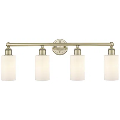 Innovations Lighting Clymer 30.88"w 4 Light Antique Brass Bath Vanity Light With White Shad