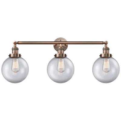 Innovations Lighting Beacon 3 Light 32" Led Bath Light - Antique Copper - Clear Shade