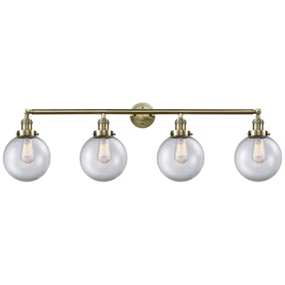 Innovations Lighting Beacon 4 Light 44" Bath Light - Antique Brass - Clear Shade