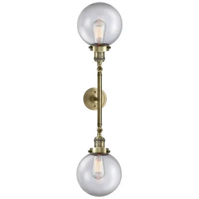 Innovations Lighting Beacon 8" Wide 2 Light Antique Brass Bath Vanity Light W/ Clear Shade