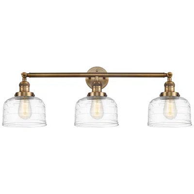 Innovations Lighting Bell 3 Light 32" Bath Light - Brushed Brass - Clear Deco Swirl Shade