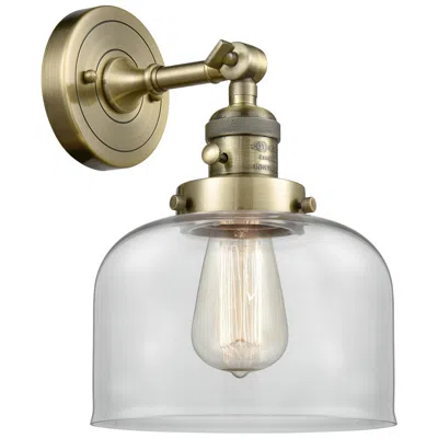 Innovations Lighting Bell 8" Antique Brass Sconce W/ Clear Shade