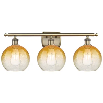 Innovations Lighting Brookhaven Globe 11"h 3-light Antique Brass Vanity Light W/ Amber Shade