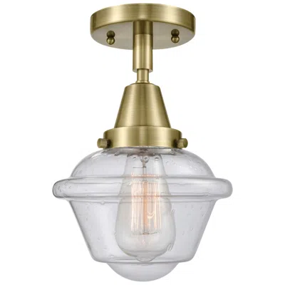 Innovations Lighting Caden Oxford 7.5" Wide Antique Brass Flush Mount With Seedy Shade