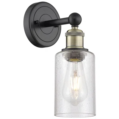 Innovations Lighting Clymer 2.6" High Black Antique Brass Sconce With Seedy Shade