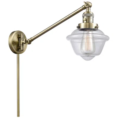 Innovations Lighting Oxford 25" High Antique Brass Swing Arm W/ Clear Shade