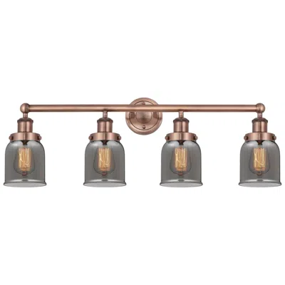 Innovations Lighting Small Bell 33.5"w 4 Light Antique Copper Bath Light With Plated Smoke