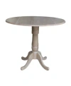 International Concepts 42" Round Dual Drop Leaf Pedestal Table In Gray