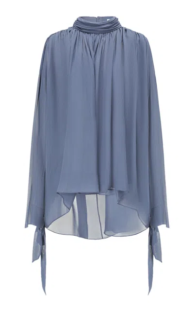 Into The East Turtleneck Batwing Sleeve Silk Top In Blue