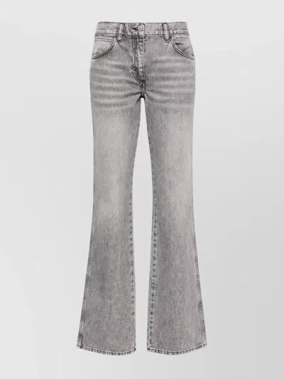 IRO DENIM TROUSERS WITH COWL EFFECT AND WRAP DESIGN