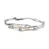 Isla Silver Women's Blue / Silver / Gold Silver Bangle With Blue Topaz & White Cubic Zirconia