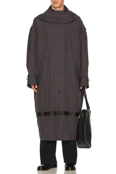 Issey Miyake Carrier Carried Coat In Brown