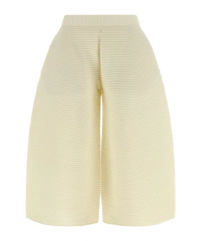 Issey Miyake Corrugated Cropped Knitted Trousers In Yellow