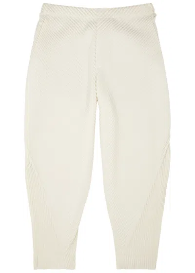 Issey Miyake Homme Plissé  Calla Lily Pleated Tapered Trousers In Neutral