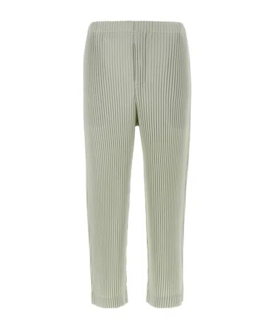 ISSEY MIYAKE HOMME PLISSÉ ISSEY MIYAKE PLEATED TAPERED LEG TROUSERS