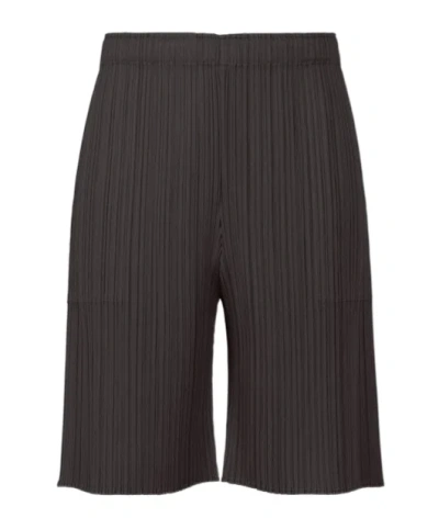 Issey Miyake Pleated Satined Cropped Trousers In Black