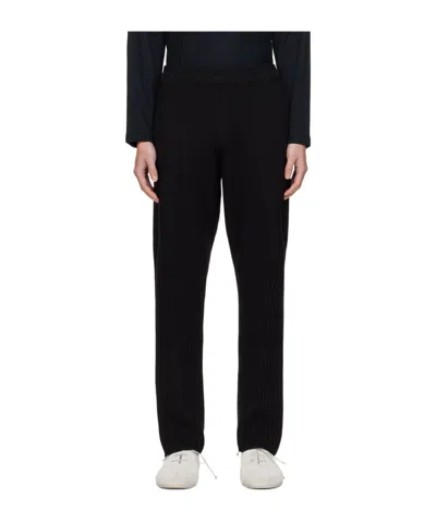 Issey Miyake Rustik-knit Tapered-leg Trousers In Black