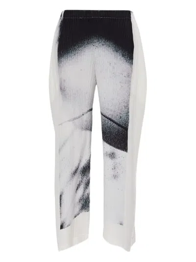 ISSEY MIYAKE SHADOW STUDY PRINTED PLEATED TROUSERS
