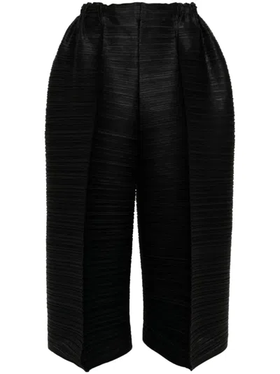 Issey Miyake Thicker Bounce Cropped Trousers In Schwarz