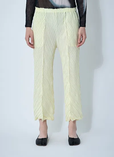 Issey Miyake Women Wrinkled And Twisted Pants In Yellow