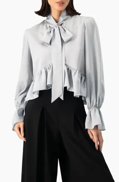 Ivonne Heathered Woven Bow Blouse With Ruffle Hem In Gray
