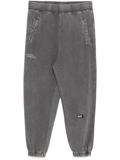 Izzue Logo-embroidered Pants In Black