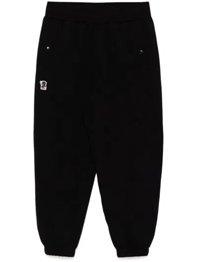 Izzue Logo-patch Pants In Black