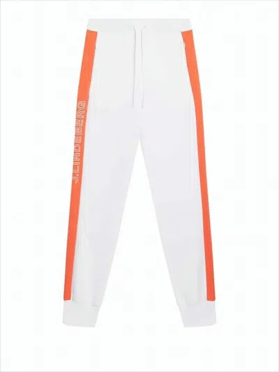 J. Lindeberg Track Pants With Orange Side Stripes In White