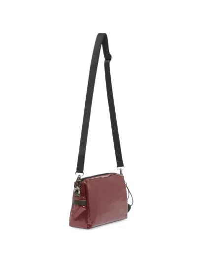 Jack Gomme Mini Light Metallic Cross-body Bag In Blue
