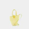 Jacquemus Le Petit Bambola Asymmetric Mini Bucket Bag In Yellow