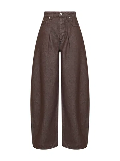 Jacquemus Curved Leg Jeans In Brown