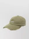 Jacquemus Distressed Brim Curved Peak Eyelet Hat In Green
