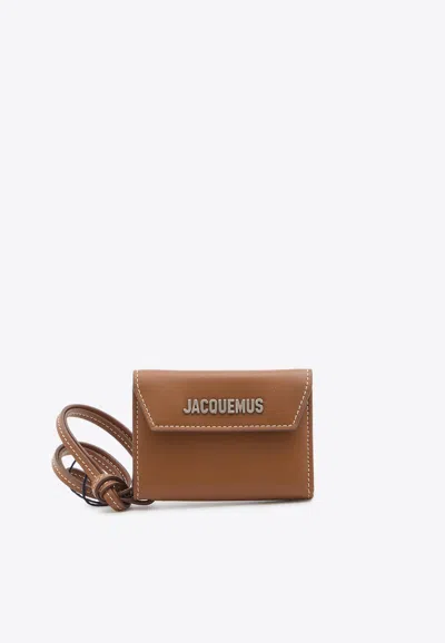 Jacquemus Envelope Leather Wallet With Strap In Brown