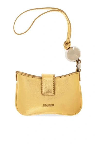 Jacquemus Le Porte Bisou Strapped Pouch In Gold