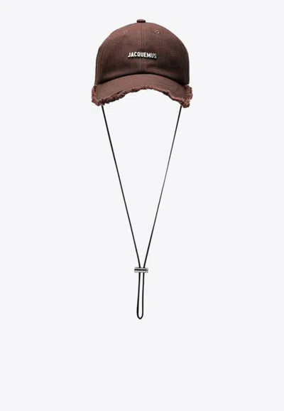 Jacquemus Logo Embossed Baseball Cap In Brown