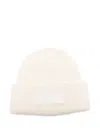 Jacquemus Ribbed White Beanie With Subtle Logo Detailing In White