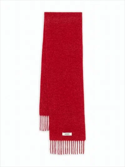 JACQUEMUS LONG RED SCARF WITH FRINGED ENDS AND SUBTLE BRANDING