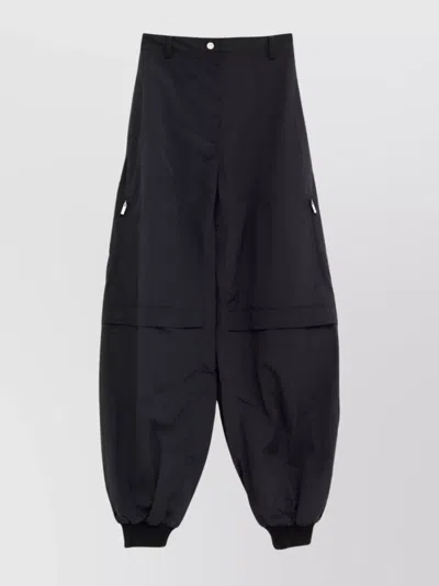 JACQUEMUS RELAXED FIT TROUSERS FEATURING SIDE ZIPPERS