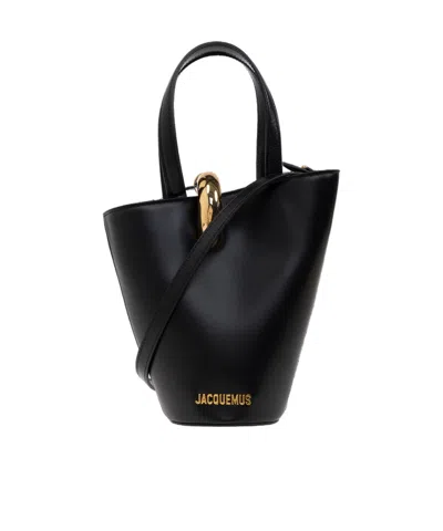 JACQUEMUS JACQUEMUS THE SMALL BAMBOLA ASYMMETRIC MINI BUCKET BAG