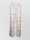 JACQUEMUS WIDE-WAIST PRINTED TROUSERS WITH BUTTON AND POCKET ACCENTS