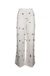 Jacquemus Wide-waist Printed Trousers With Button And Pocket Accents In Multicolor