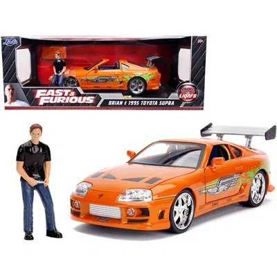 Jada Toys Jada 1995 Toyota Supra Orange Metallic With Lights & Brian Figurine Fast & Furious Movie 1-18 Scale