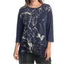 Jess & Jane Scrolls Mineral Washed Asymmetric Top In Denim In Blue