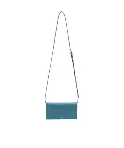 Jil Sander All-day Logo Embossed Small Crossbody Bag In Blue