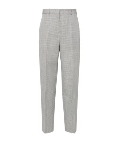 JIL SANDER JIL SANDER CHECKED TAPERED LEG TROUSERS
