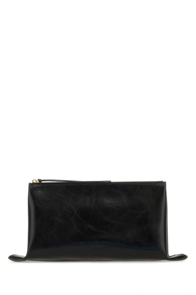 Jil Sander Goji Soft Logo Embossed Clutch Bag In Black