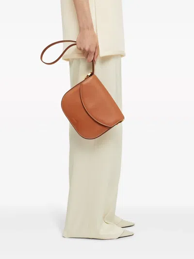 Jil Sander Logo-debossed Leather Crossbody Bag In Brown
