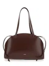 Jil Sander 'curve Medium' Brown Shoulder Bag With Embossed Logo On The Front And Curved Design In Brown